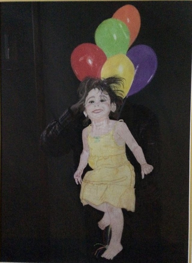 Happy Dance: A little girl in a yellow dress dancing beneath a bunch of balloons, set against black.