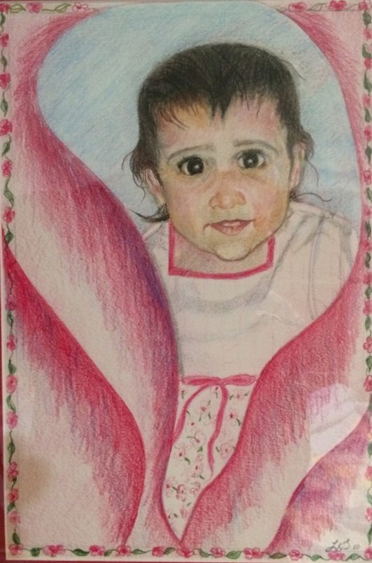 A dark-eyed baby peeking out from a pink blanket, framed by a border of small flowers.