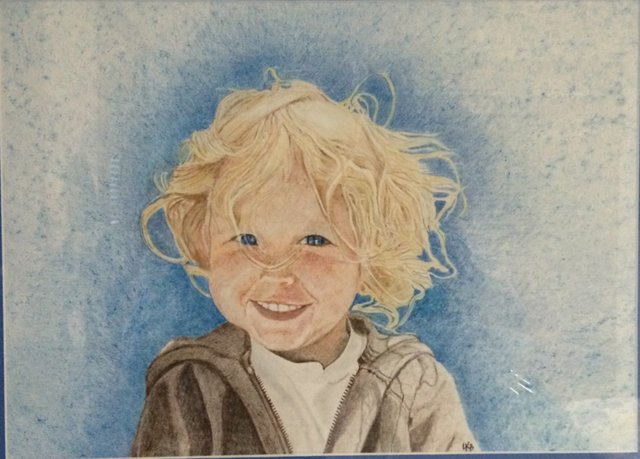 Little Blondie: A smiling child with tousled blond curls against a speckled blue background.