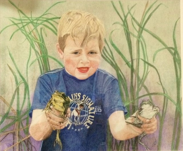 A grinning boy among tall grasses, holding up a frog in each hand.